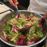 Winter chicories salad with radicchio, frisée, watermelon radish, walnuts, and gorgonzola drizzled with citrus balsamic dressing.