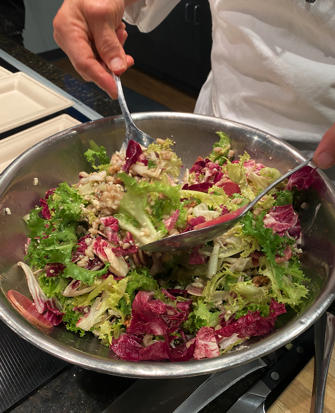 Winter chicories salad with radicchio, frisée, watermelon radish, walnuts, and gorgonzola drizzled with citrus balsamic dressing.