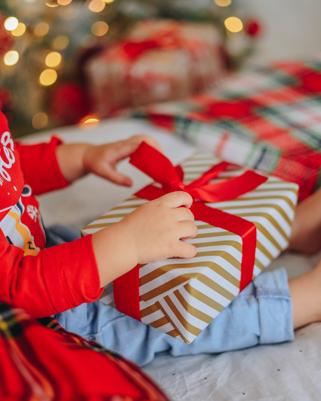 Peaceful holiday scene with candles, and presents symbolizing calm and relaxation during the holiday season.