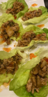 Chicken lettuce wraps with ground chicken, water chestnuts, and peanuts in butter lettuce cups.
