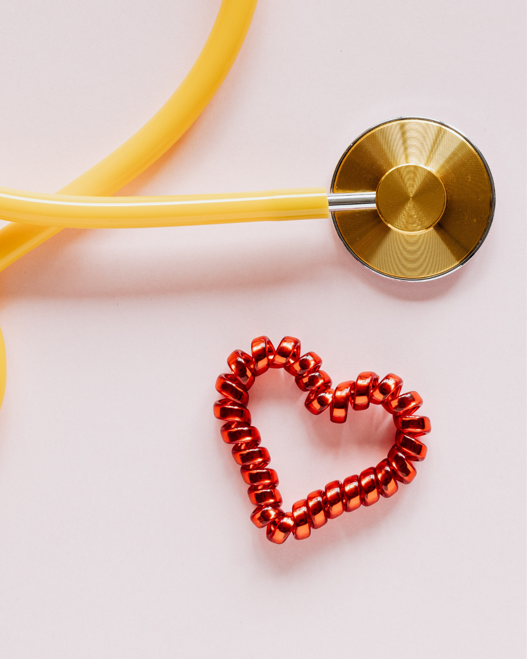 Heart health concept with stethoscope, fresh vegetables, and lifestyle symbols representing prevention and cardiovascular wellness.
