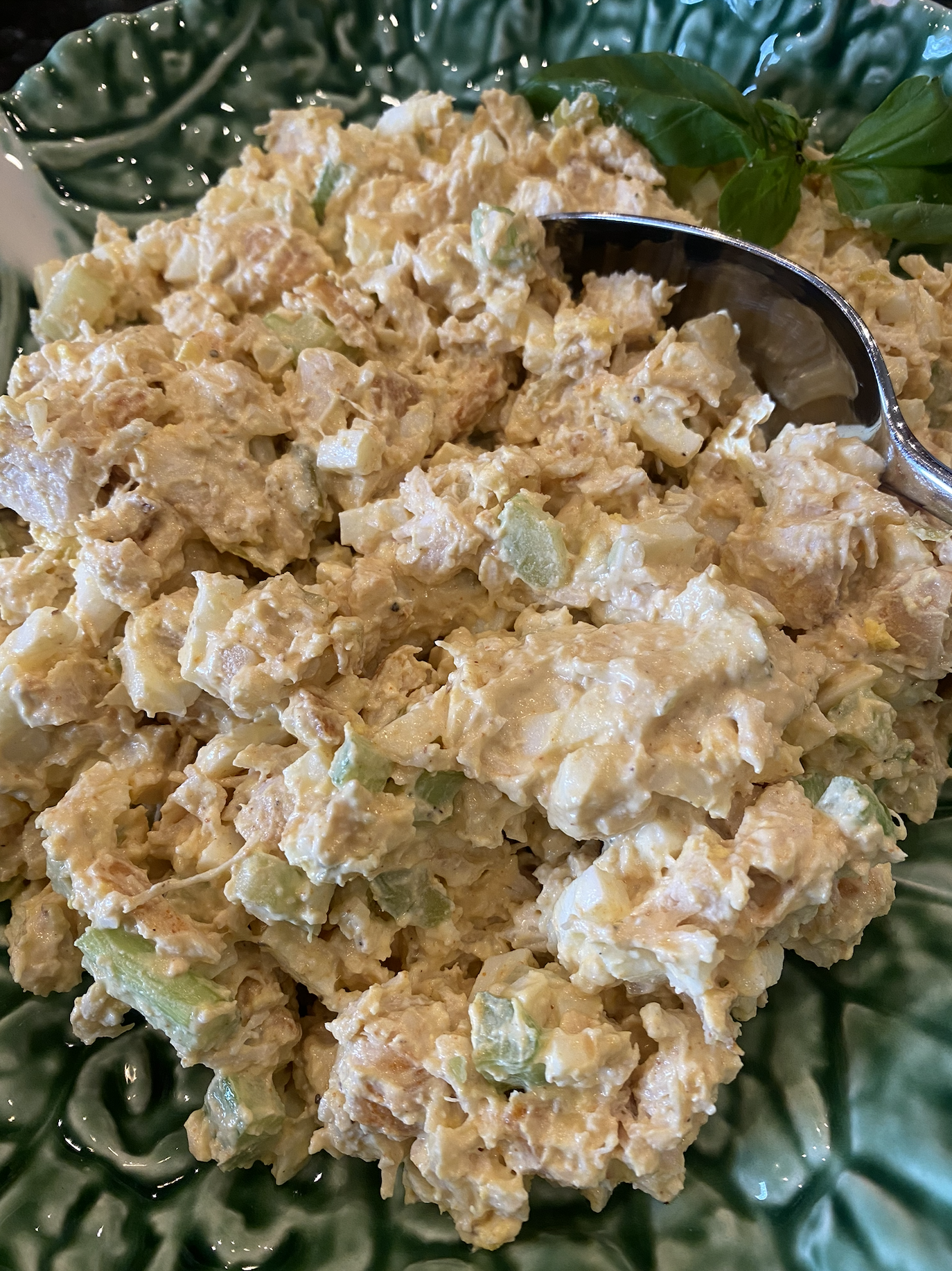 High protein chicken salad made with Greek yogurt and eggs in a white bowl.