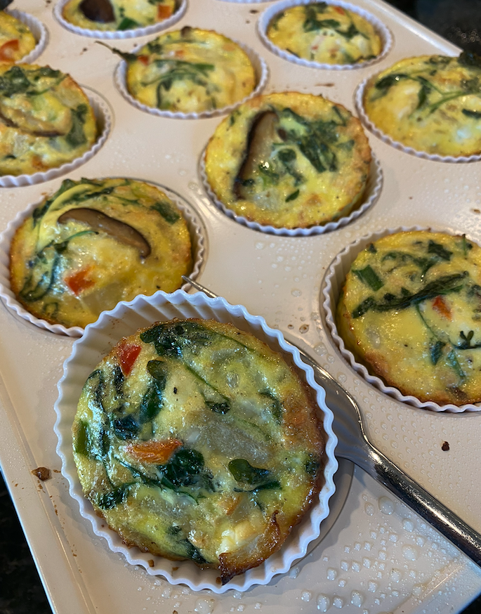 High-protein egg muffins made with vegetables and cottage cheese in a muffin pan