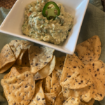 Guacamole with toasted cumin, lime, cilantro, and fresh avocado in a bowl