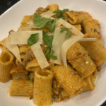 Mediterranean bolognese with lamb, harissa, mushrooms, and goat cheese served over pasta