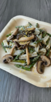 Risotto-style pasta with asparagus, wild mushrooms, lemon zest, and Parmesan