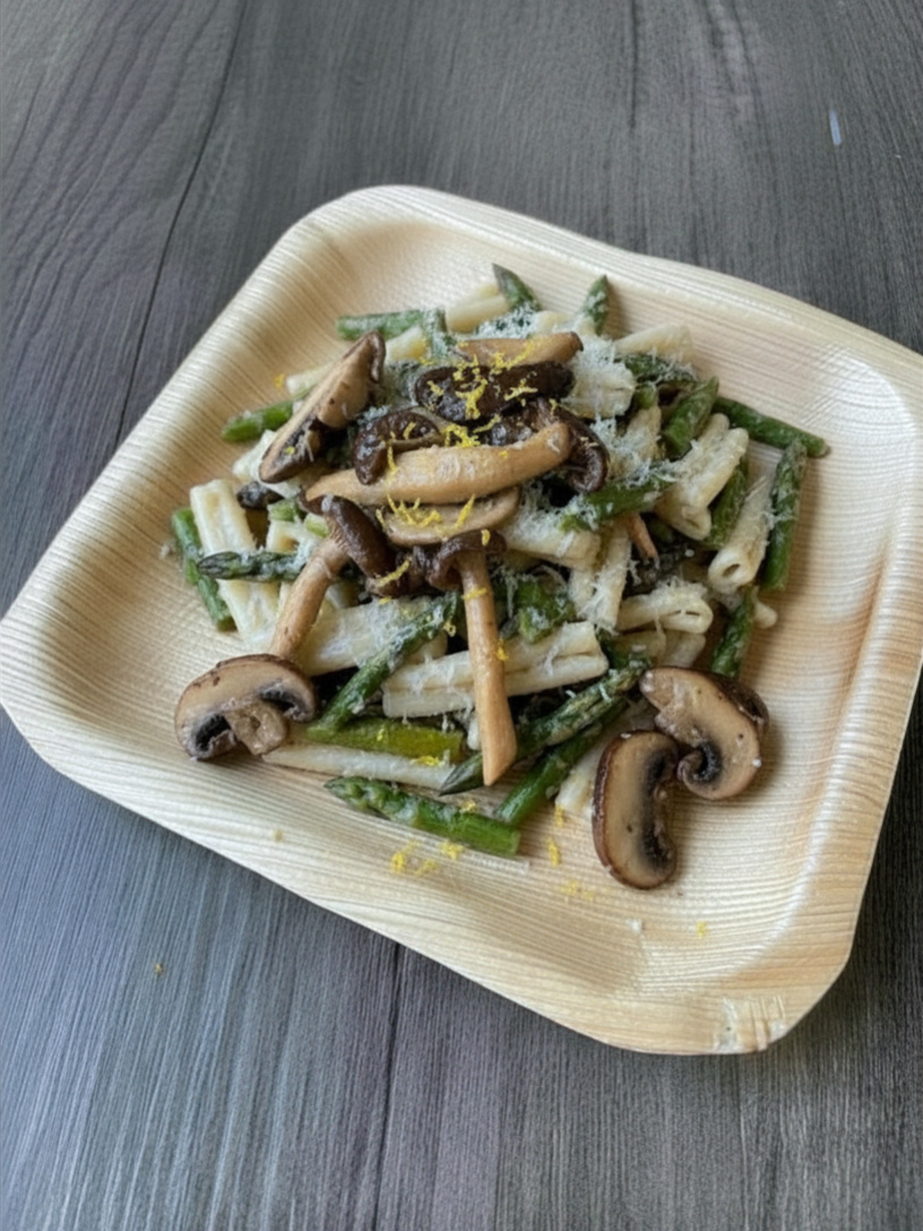Risotto-style pasta with asparagus, wild mushrooms, lemon zest, and Parmesan