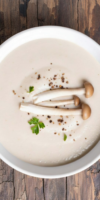 Creamy truffled cauliflower soup topped with roasted shallots and shiitake mushrooms