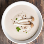 Creamy truffled cauliflower soup topped with roasted shallots and shiitake mushrooms
