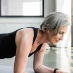 Person performing a plank exercise as part of a daily core strengthening routine